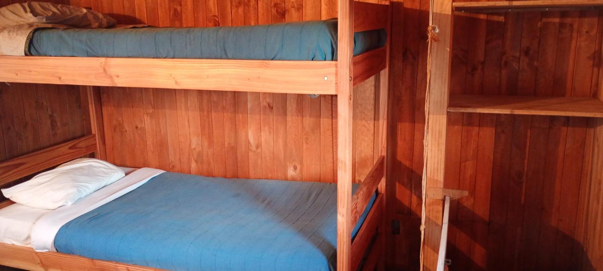 Hostal Quillelhue Пукон Номер фото